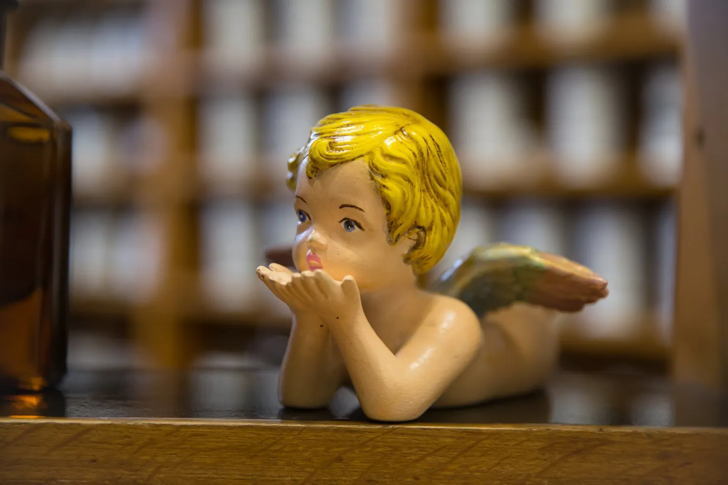 The pharmacy's ceramic angel in front of the old jars